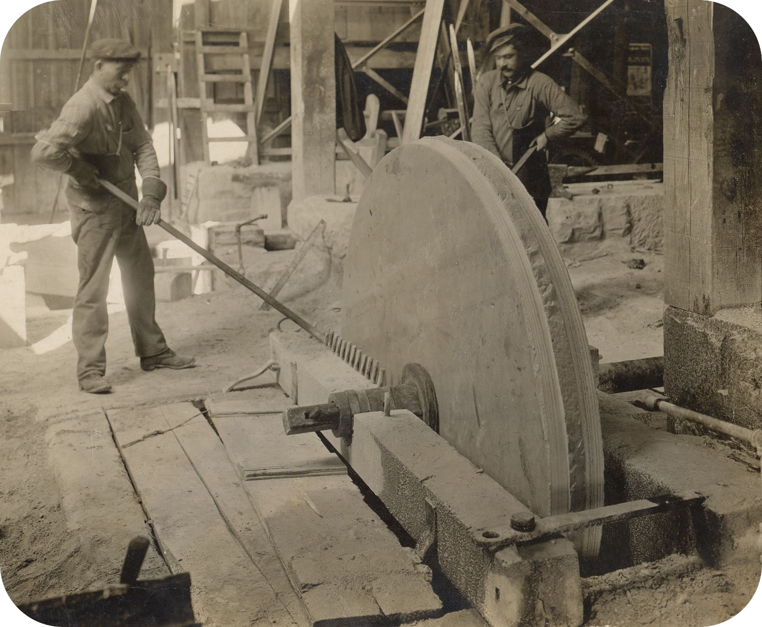 Men Grinding with Sandstone